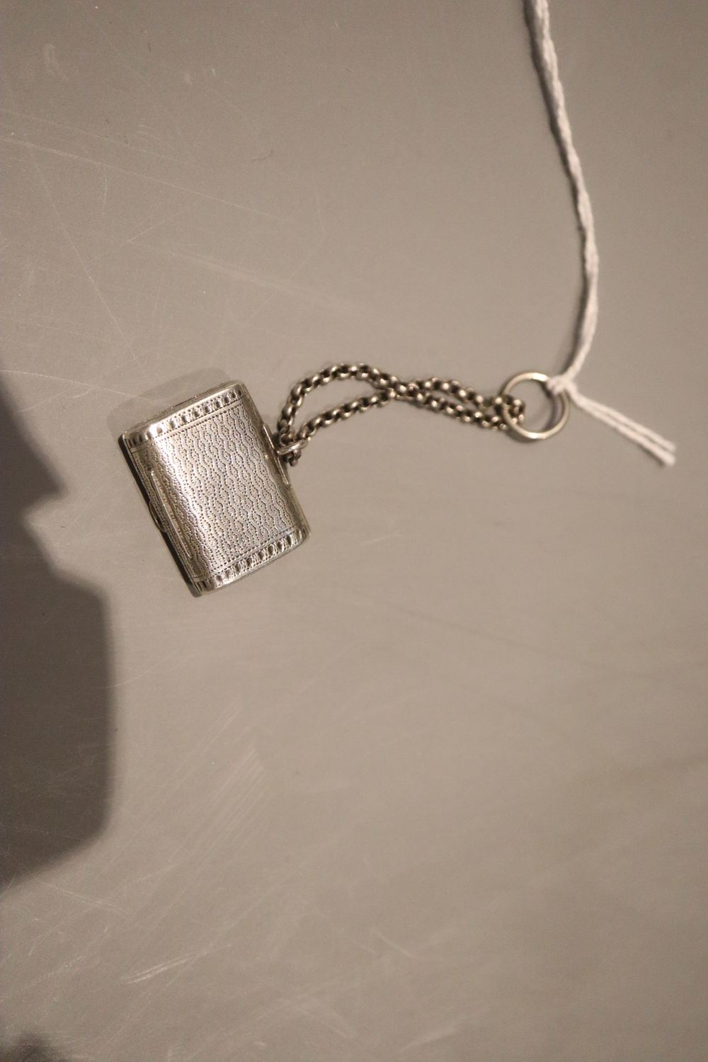 A George III engraved silver vinaigrette, modelled as a satchel, John Shaw, Birmingham, 1816, 27mm